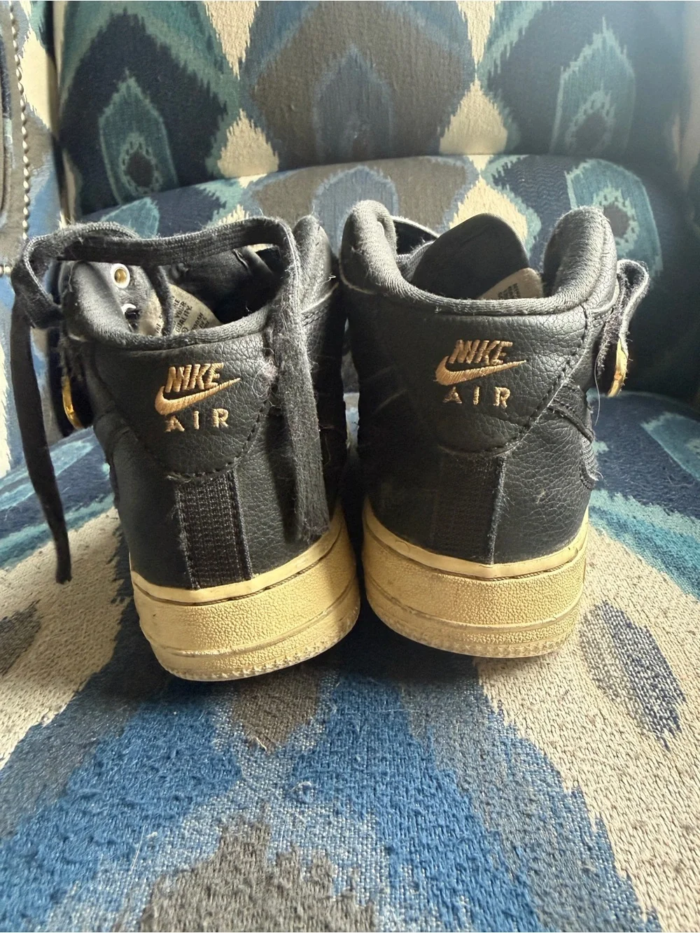 Nike Kids Black Sneakers with Gold Eyelets